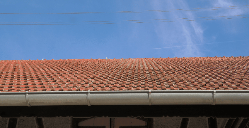 Copper gutters running along a home's roof edge