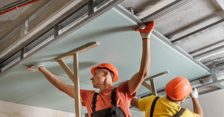 Scoring and snapping a drywall panel to size